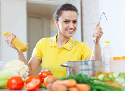 Woman cooking with fresh produce