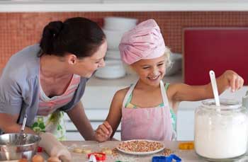 Mum and Daughter Cooking in the kitchen