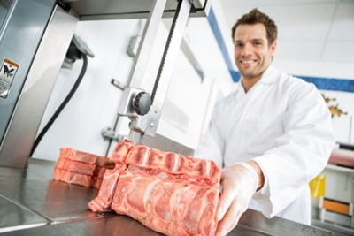 Shop butcher cutting t-bones