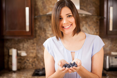 lady holding blackberries