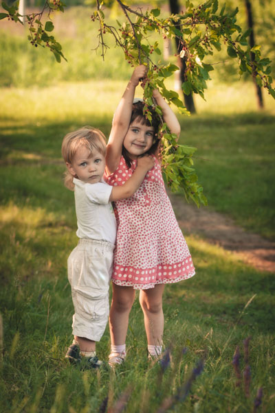 kids swinging on mulberry branch