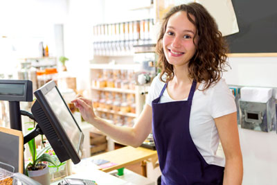 Young woman working as a shop attendant