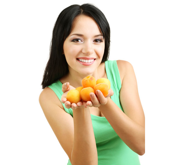 Young lady with apricots