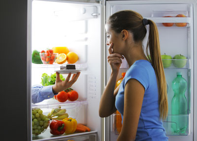 your woman looking into her fridge for options