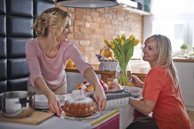 Women in the kitchen with beautiful ring cake
