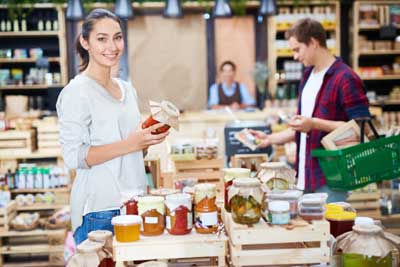 Young woman looking at Jams shopping